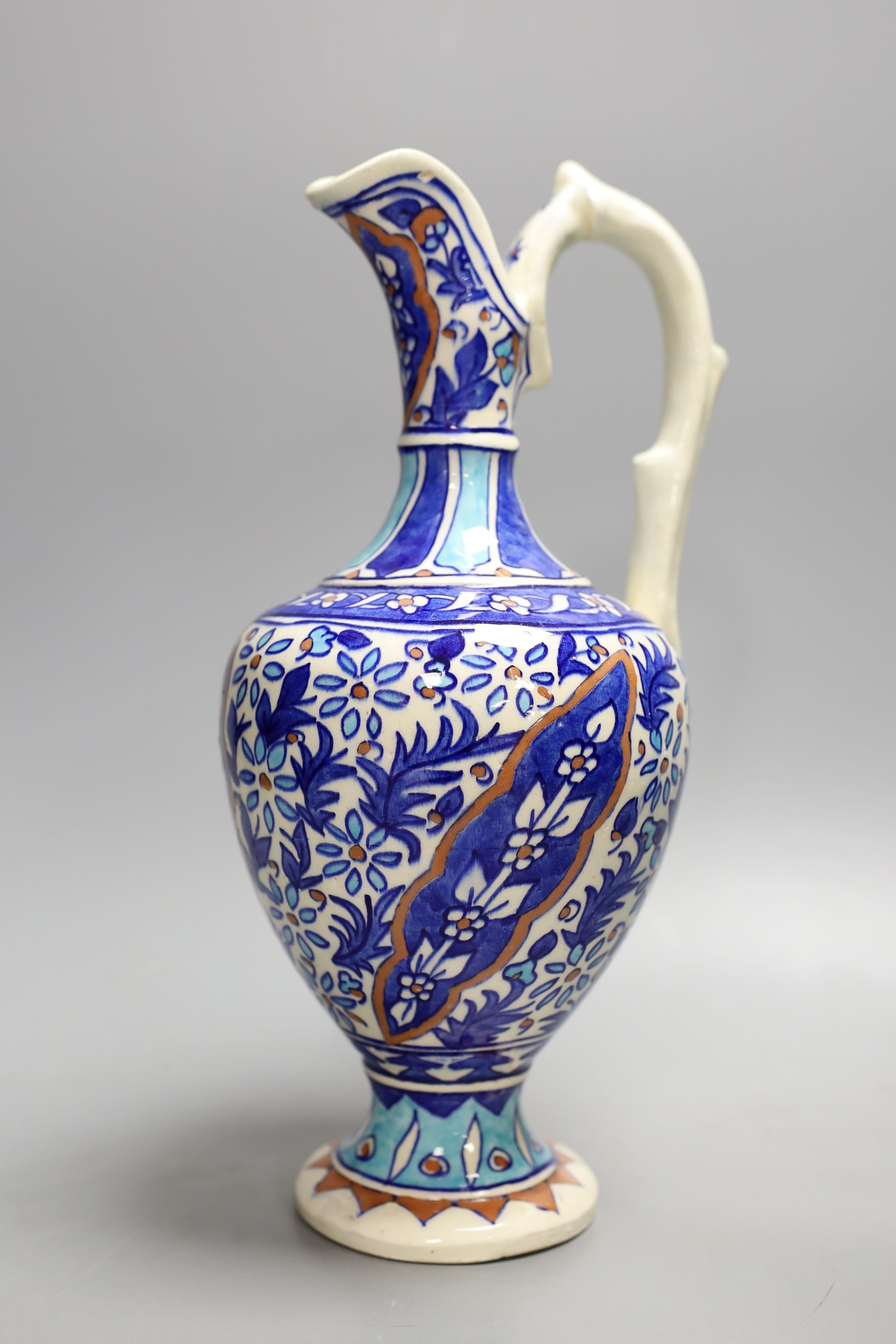 A Turkish Iznik style earthenware ewer, 20th century, 31. 5 cm high